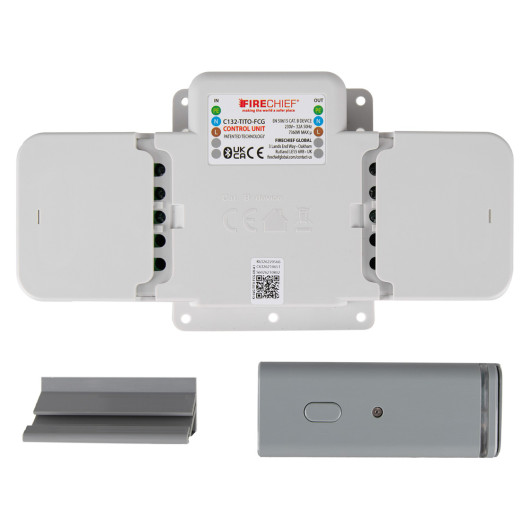 Rectangular Firechief electrical control unit with labelled terminals and two small metallic components placed below it