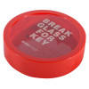 Angled view of a circular break glass keybox with red frame and clear cover showing white text on glass panel