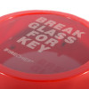 Close up of a circular break glass keybox with red casing and clear cover showing white text inside