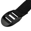 Closeup of the end of an adjustable co2 extinguisher strap showing the black plastic buckle and woven fabric strap