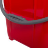 Close-up of the handle on a red plastic fire bucket showing the grip and part of the bucket side