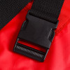 Close-up of a black plastic buckle on the harvest healthcare evacuation sheet red fabric strap