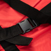 Close up of the buckle on the evacuation sledge with wall mounted storage bag showing black straps and red fabric