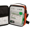 A white defibrillator inside an open bright orange carry case