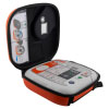 A white defibrillator inside an open bright orange carry case