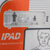 A close-up of the adult / child mode button