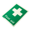 Angled photo of a rigid plastic first aid sign with white cross and text on a green background