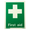 Green first aid sign with a white cross and text on rigid plastic shown from the front