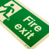 Close up of a fire exit sign rigid plastic left size t showing a green background with a running figure and the words Fire exit