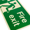 Close up of a fire exit sign rigid plastic up left size j showing the green and white design and text