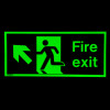 fire exit sign rigid plastic up left size j showing a glowing green figure running towards an arrow in the dark