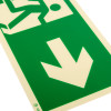 Close up of fire exit sign rigid plastic right size k showing arrow pointing down and part of person running symbol