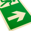 Close up of the fire exit sign rigid plastic up size k showing a white arrow and a running figure on a green background
