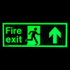 fire exit sign rigid plastic up size k glowing bright green on a dark background showing running figure and arrow pointing up