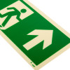 Close up of a fire exit sign rigid plastic up size t showing a green running figure and upward arrow on white background