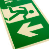 Close up of fire exit sign rigid plastic down size j with green background and white running figure and arrow pointing down left