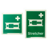 Front view of stretcher location sign with and without text on rigid plastic showing green background with white symbols and text