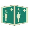 panoramic sign showing a person under an emergency shower with a medical cross on a green background