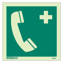 emergency telephone sign showing a pale telephone handset and medical cross on green background front view
