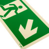close-up of fire exit sign rigid plastic down right size t showing a running figure and a downward arrow