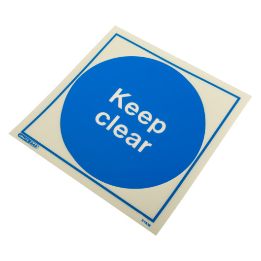 Angled view of a keep clear sign rigid plastic with a blue circle and white text on a square background