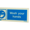 Closeup of a wash your hands sign landscape with white text and a washing hands symbol on a blue background