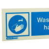 Close-up detail of wash your hands sign landscape showing hand under running water symbol on blue background