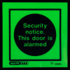 Alt text: Glowing Js5480A Security Notice This Door Is Alarmed Vinyl Sign with black text on a green background