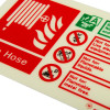 Closeup of Js6375Id Jalite Photoluminescent Fire Hose Sign landscape showing text and hazard symbols