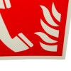 Closeup of the fire telephone panoramic sign without text showing a red background with a white telephone handset and flames design