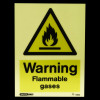 warning flammable gases sign showing a glowing yellow triangle with a black flame symbol and warning text below