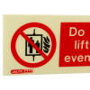 Close-up detail of the lift prohibited sign showing a red circle and slash over an elevator symbol with flames