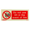 Front view of a lift prohibited sign showing do not use lift in the event of fire message in red and white