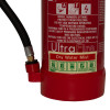 Close up of dry water mist self adhesive sticker on a red fire extinguisher showing safety information