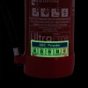 close up of abc powder self adhesive sticker glow in dark showing safety and usage information on a fire extinguisher
