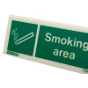 Closeup of designaated smoking area table top sign showing a smoking cigarette icon and text reading smoking area