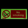 Glowing no smoking table top photoluminescent sign showing no smoking symbol and text in red on green background