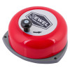 angled view of a red jewel rotary hand bell with a black rotary knob and a white label on top