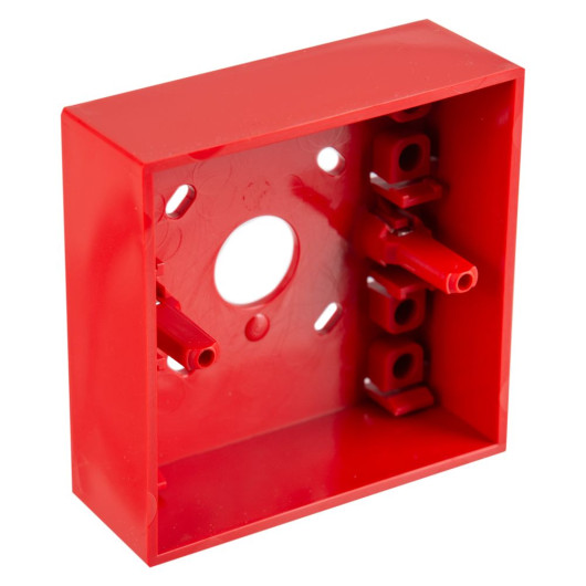 An angled view of a red surface‑mounting call point back box, showing the internal mounting posts, screw terminals, and central circular opening.
