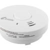Close-up of Kidde 10yr battery optical smoke alarm showing the sounder and control button on white surface