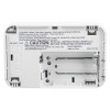 carbon monoxide alarm showing the back with the battery compartment open and visible instructions on the inside