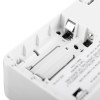 Carbon monoxide alarm close up showing an empty battery compartment with visible metal contacts and warning label