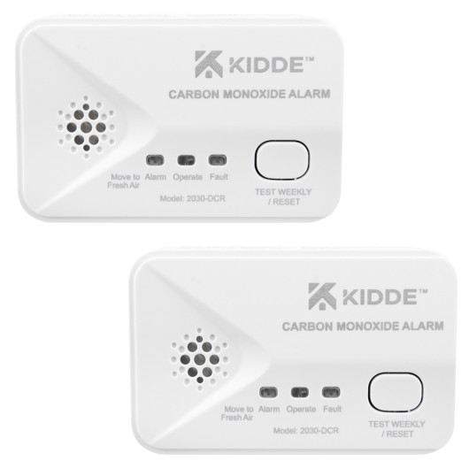 Two angled Kidde battery carbon monoxide alarms in a twin pack showing buttons and labels
