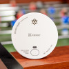 Ke2030Dsr Kidde 2030 Dsr Battery Smoke Alarm shown close-up on a wooden surface with visible test button and labels