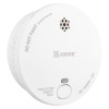 angled view of kidde battery optical smoke alarm with test button and vent holes visible