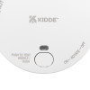 Close up of the test hush button on a smoke alarm showing text and switch details