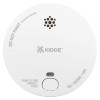 Front view of a round smoke alarm with a test button and ventilation holes visible