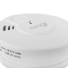 Close-up view of the surface details and vents on a white kidde battery optical smoke alarm