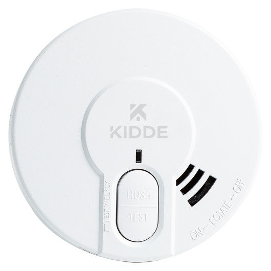 White circular Kedy29 Kidde Dy29 battery optical smoke alarm showing front panel with hush and test buttons and Kidde logo