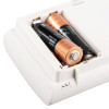 Closeup of two Duracell batteries inside the compartment of a kidde co digital alarm